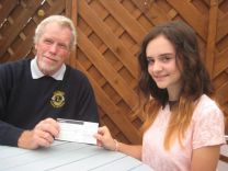 Girl Guide Phoebe Roberts receives 100 from Honiton Lions 